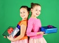 Children open gifts for Christmas. Girls with smiling faces Royalty Free Stock Photo