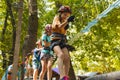 The children are overcoming obstacles in the rope park Royalty Free Stock Photo