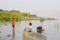 Children paddling in the water at the western shore of the Sea of Galilee