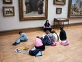 Children paint sitting on floor in the Tretyakov Gallery in Moscow Royalty Free Stock Photo