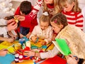 Children painting and cut sissors paper at art