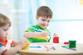 Children painting in daycare or nursery Royalty Free Stock Photo