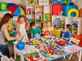 Children painting and drawing together. Craft lesson in primary school. Royalty Free Stock Photo