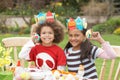 Children Painting Easter Eggs In Gardens