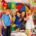 Children painting finger on easel. Small students in art school class. Royalty Free Stock Photo