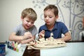 Children painting model of a warship