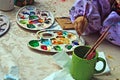 Children painting pottery 10