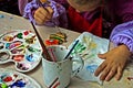 Children painting pottery 3