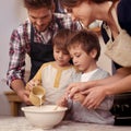 Children, parents or baking in kitchen with ingredients, home or learning of dessert cake with love. Happy family Royalty Free Stock Photo