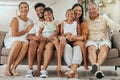 Children, parents and happy grandparents on sofa, generations of family together in living room. Love, home and couple Royalty Free Stock Photo