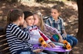 Children in the park on a bench in autumn Royalty Free Stock Photo