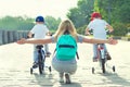 Children participate in competitions riding a bicycle. Family holiday on the promenade.