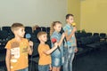 Children participate with a microphone, recite poems, recitation, sing songs Royalty Free Stock Photo