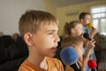 Children participate with a microphone, recite poems, recitation, sing songs Royalty Free Stock Photo
