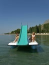 Children on pedal boat at sea 2