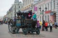 Children are photographed on a copy of the carriage of Empress Catherine II on the street Bauman. Kazan