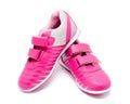 Children pink sport shoes isolated