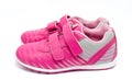 Children pink sport shoes isolated