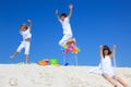 Children and pinwheels on sand Royalty Free Stock Photo
