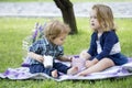 Children on pirnic. Child baby playing on sunny field, summer outdoor kids lifestyle.