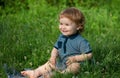 Children on pirnic. Cute baby on green grass in summertime. Funny little kid on nature. Happy Childhood. Royalty Free Stock Photo