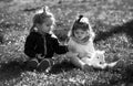 Children on pirnic. Cute boy and girl sit on grass on summer field. Happy baby children playing on green grass in spring Royalty Free Stock Photo