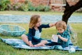 Children on pirnic. Lifestyle portrait baby child in happines at the outside in the meadow. Brother and sister play Royalty Free Stock Photo