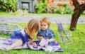 Children on pirnic. Portrait of cute little caucasian boy having fun in garden. Cute kids love. Little girl kissing Royalty Free Stock Photo