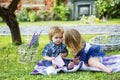 Children on pirnic. Portrait of cute little caucasian boy having fun in garden. Cute kids love. Little girl kissing Royalty Free Stock Photo