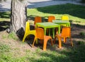 Children plastic chairs and tables on grass Royalty Free Stock Photo