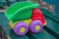 Children plastic toy truck in park on a bench Royalty Free Stock Photo