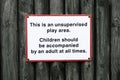 Children play area unsupervised accompanied by adult all times Royalty Free Stock Photo