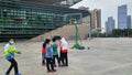 Shenzhen, China: children play basketball on a basketball court as the stadium facility is reopened following a decisive victory i Royalty Free Stock Photo