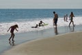 Children Play at the Beach in Ocean Waves Royalty Free Stock Photo