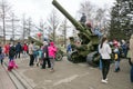 Children play on the big guns, which stand near the museum of the Victory Memorial during the celebration of Victory Day WWII.
