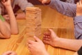 Children play a board game, a wooden tower Royalty Free Stock Photo