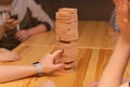 Children play a board game, a wooden tower. Royalty Free Stock Photo