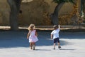 children play carefree in a small square in the historic center of Heraklion