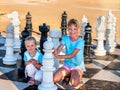 Children play chess outdoor Royalty Free Stock Photo