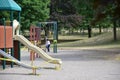 Children play on a closed Toronto public playground during the Covid-19 Pandemic.