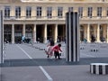 Children play among the Colonnes de Buren, Palais Royal, Paris Royalty Free Stock Photo