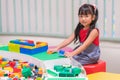 Children play with colorful plastic toys blocks on table Royalty Free Stock Photo