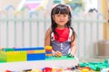 Children play with colorful plastic toys blocks on table Royalty Free Stock Photo
