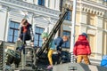 Children play on a combat military armored personnel carrier of the Ukrainian army. Exhibition of military equipment in Kiev.