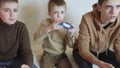 children play on the console with joysticks in ruhs