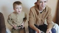 children play on the console with joysticks in ruhs