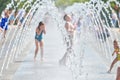 Children play in dry fountain