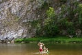 Children play with father in summer, on sunny day. father, son and daughter splashing water. Family traveling concept