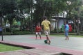 Children play football in the garden city