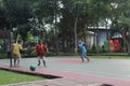 Children play football in the garden city